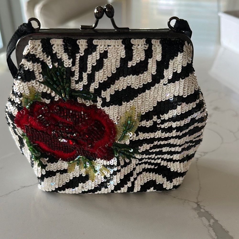 Sequin Zebra Pattern Clutch with Red Floral Accent